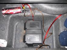 Battery located into the trunk floor