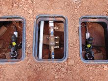 2 PRV's and shutoff valves installed in ground, left rea