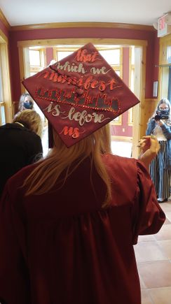 The cityscape in the center of the cap is that of Columbus, location of THE Ohio State University.