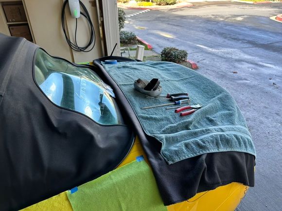 Organized and detailed, he puts down towels and microfiber cloths to prevent paint damage. 