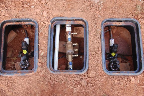 2 PRV's and shutoff valves installed in ground, left rea