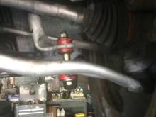 Here in the picture is the driver side. This is little confusing to me.The top gap between the new bolt and the top bar 
