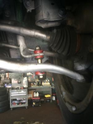 Here in the picture is the driver side. This is little confusing to me.The top gap between the new bolt and the top bar 