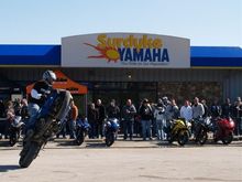 Dan Farley circle wheelie in front of Surdyke Motorsports