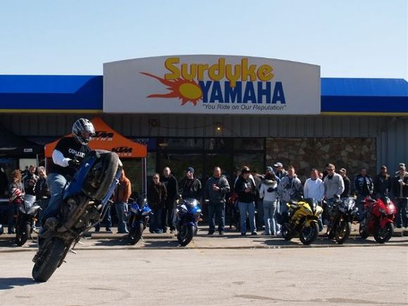 Dan Farley circle wheelie in front of Surdyke Motorsports