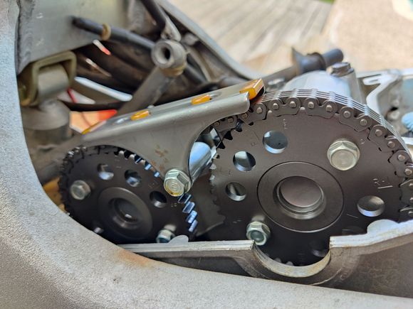 The rear cylinder has the exhaust valves operated by the cam on the left.  Note the frame blocks a straight on view of the marks on the gear.  Difficult to determine position of the "RE" mark.