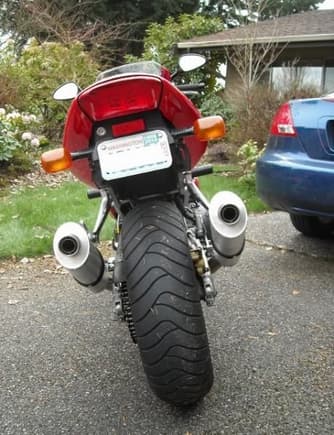 Removed the ugly license plate lamp and moved the plate up on the fender.