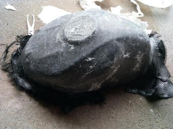 As you can see the part looks OK but the wax failed me big time. Hence the fiber stuck to it. It may have melted when curing. I honestly suggest clear tape for a cheap job it leaves such a small edge its easy to sand out.