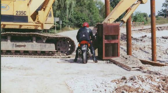 Wearing my full Leathers combat touring boots and RF 200 helmet Around A crane they thought had blocked the road Circa 1999