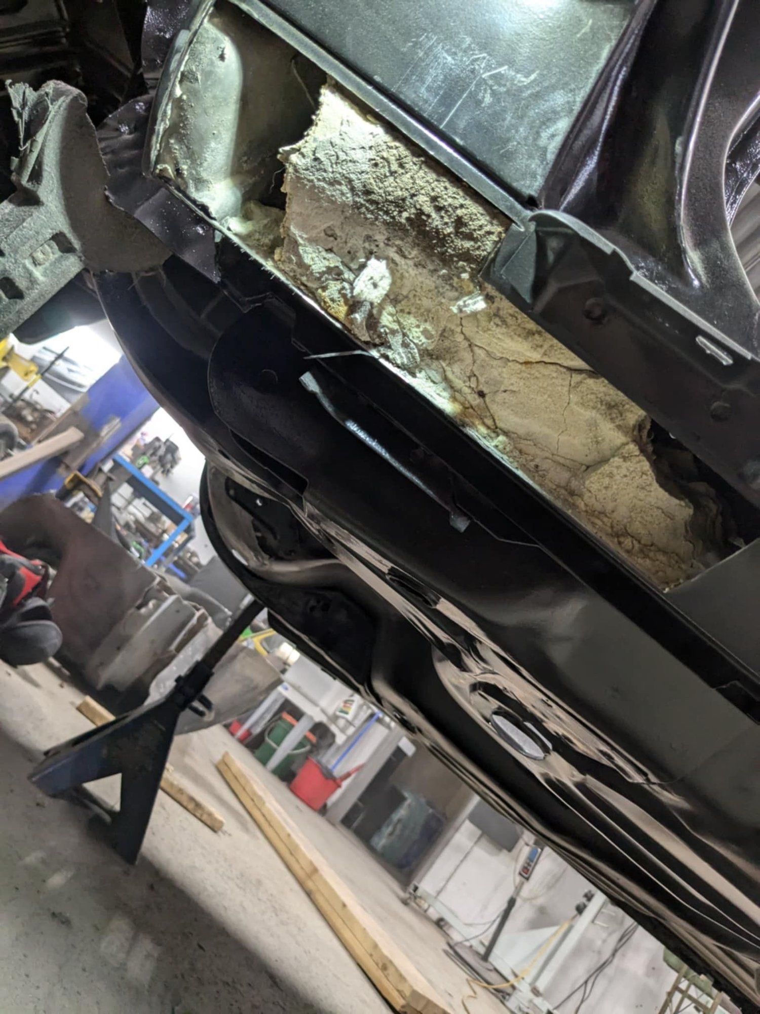 Except we found about 20lbs of blasting media.  Be aware that this kind of thing could happen for anyone that gets their car sand blasted...We figure when the car was being rinsed, the sand and water drained into this part.