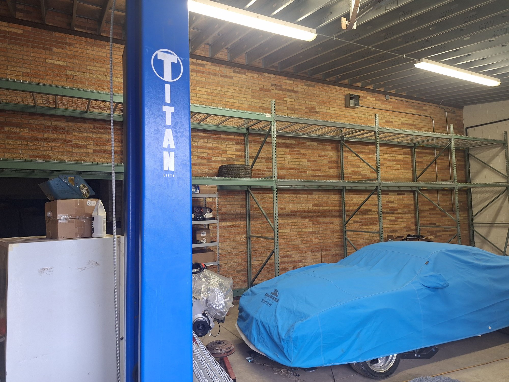 Current stage of the project is shop setup. 40' of pallet racking setup but needs to be bolted down. The plan is to put lights under each bay and make workspaces for lathe mill etc. Searching for a hammer drill to install the bolts in the racks and to install the two post.