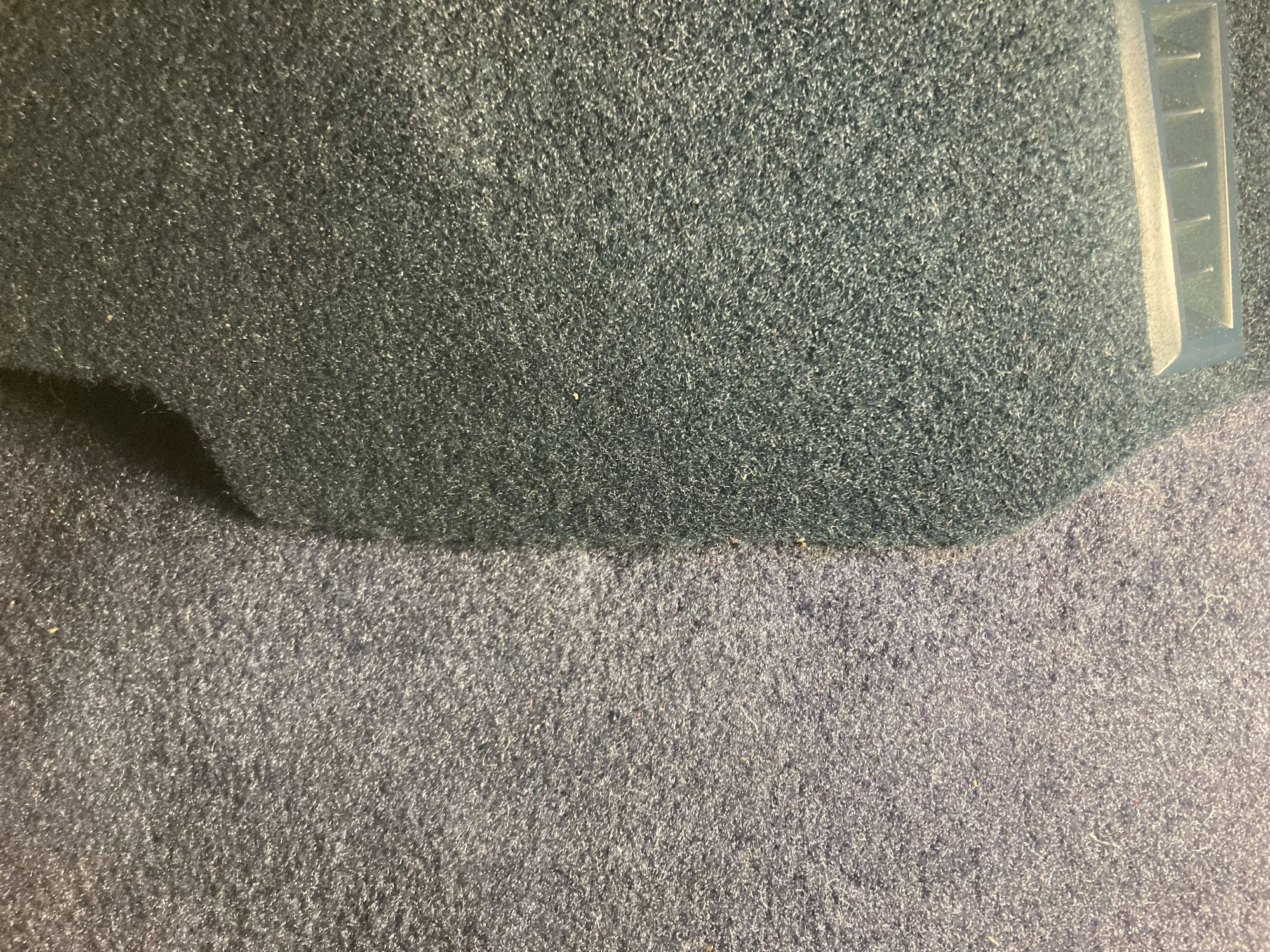 Here is a picture of the lower console that I bought that included the carpet, and the new carpet from ACC. The color is deceiving since this is in the car using an LED work light.