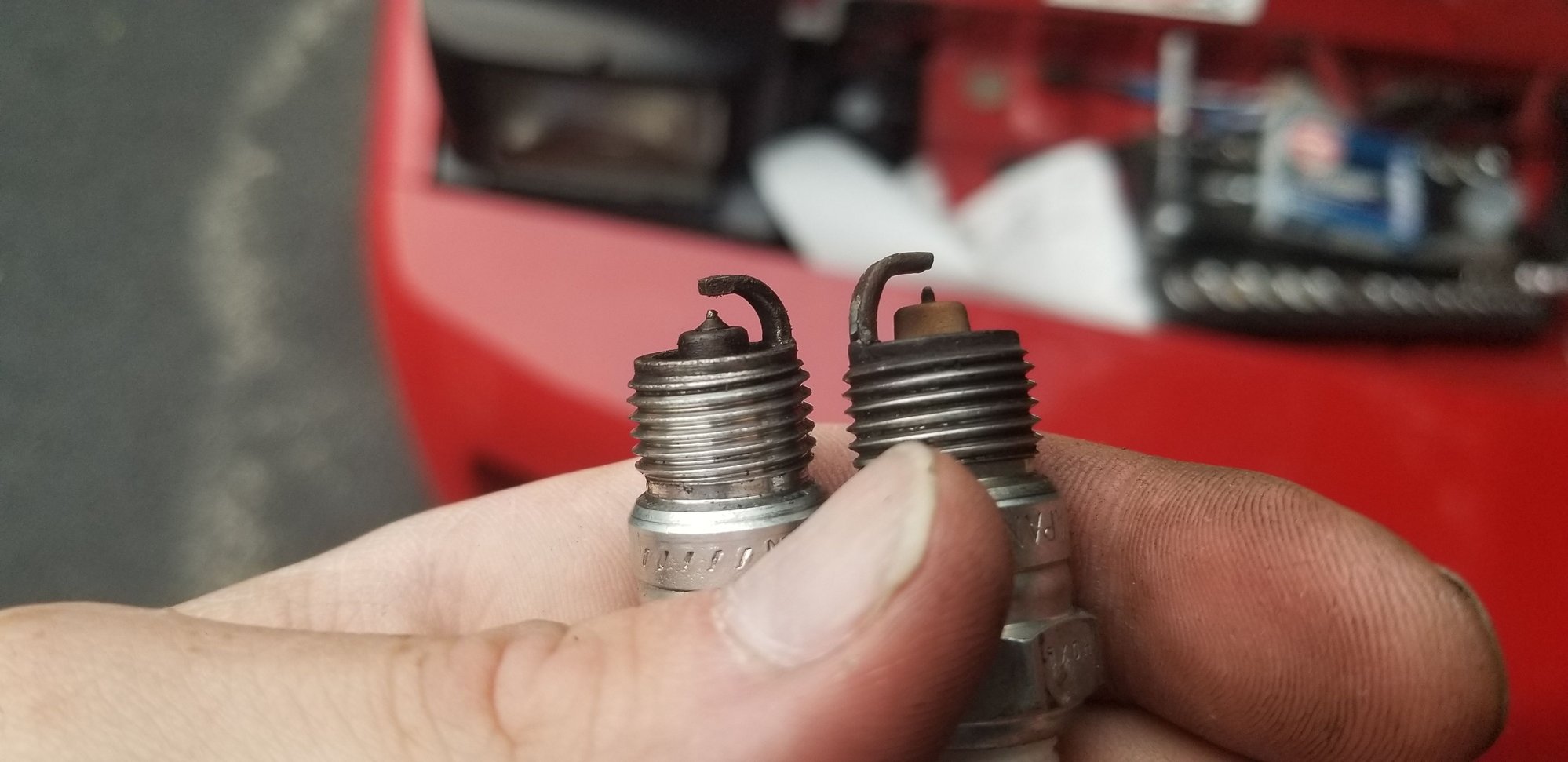 New plug on left after being cleaned up; 2 year old plug on right