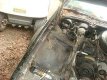 Pulling the fender off the parts car to get factory hardware.