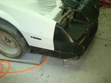 Just checking the nose to fender fit before starting bondo work. It is not bolted on but rather just setting on the studs. Looks to fit pretty good already.