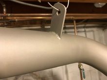 Muffler tail pipe coated with new hanger