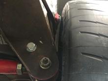 Tire hits panhard mount and still sticks outside of fender.
