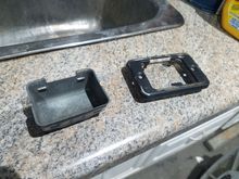 Hey, if I straightened these four little tabs, the cover plate can separate from the housing and the paint job will look even better!  I might need professional help...