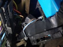 Tucks nicely in above the bracket and zip tied in place.