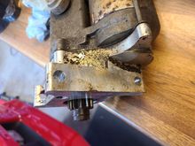 Starter as removed. Some oil residue layer on aluminum mount.