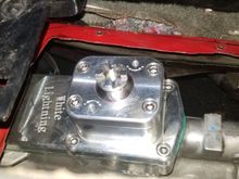 Another view.  You can see the two holes for adjusting the spring bias, though it comes set to "full aggressive" right out of the box