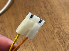 It’s as if they should plug in but they just won’t. The white plastic between the two prongs keeps it from plugging into the black one. 