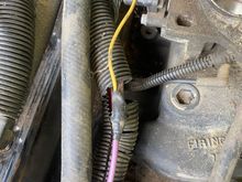 In my 1990 Bandit II Edition Firebird I have this wire that runs from a button under the dash into this purple wire in the wiring harness in the engine bay. The other side of the wire on the button isn’t connected currently and I have no idea what it’s for. What is the big purple wire for? And what might the button be for?