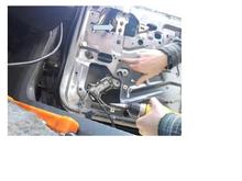 Mine does not have those two screw. There is only one screw that holds the two metal plates together. When loosened, I can slide the back metal piece up and down.