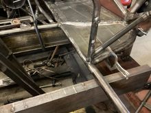 Welding in driver side floor pans. I made them out of 22 gauge, bead rolled and hammer formed around the tubes