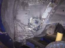 Drivers side rear wheel well rust repair continues
