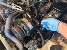 I was pulling off smog stuff and accidentally tore this loose. It came from somewhere underneath the number 2 spark plug (front driver side)