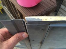 Slight under view of cargo cover hinge from 82-84 model year.