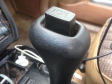 Pulled the shiny button cover up and off