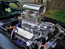 Here's a pictures of the power plant. It's 468ci Big Block with a Weiand 8-71 Blower. It has an Eagle 4340 crank &amp; I-beam rods, TRW forged blower pistons, Crane solid roller cam &amp; lifters, Crane Gold 1.7 roller rockers, and a Pete Jackson gear drive. It's also equipped with a 325 HP Nitrous system. It has a Holley electric fuel pump, a Barry Grant fuel pressure regulator, and dual Holley 750 Double Pumpers. It has an MSD Ignition consisting of a Pro-Billet distributor, 6-AL Box, Stage II RPM Module, and a Blaster II coil. It breathes through Dynomax headers and a 3&quot; Flowmaster exhaust system. It makes roughly 750 HP on the motor, and 1000  HP on the Nitrous.