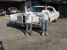 My first (running) car. A 1976 Chrysler New Yorker Brougham 2dr Coupe, 440 Chrysler engine. That's me and my brother at about 13 and 11 years old.