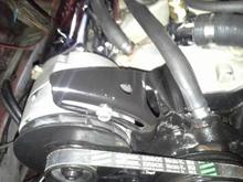 customized stock alt mount cut on band saw edge rounded on grinder and spray painted by my mechanic/custom fabricator/friend