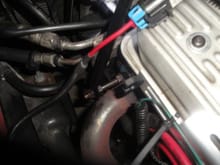 Reused exhaust manifold bolt to support alternator rear bracket