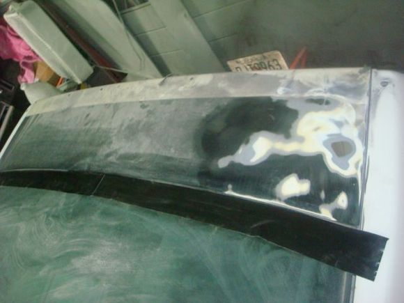The black had been painted with the spoiler still on the car as you can see the factory paint where it had been.