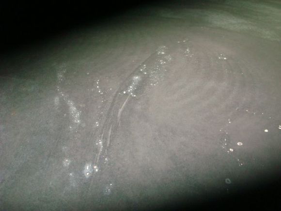 Lightly sanding the black with 180 on an orbital revealed where the bondo and paint were bubbling underneath.