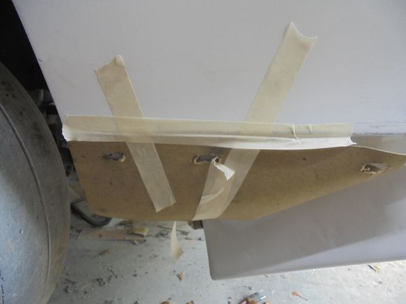 Flipped over and taped in place on the passenger fender.