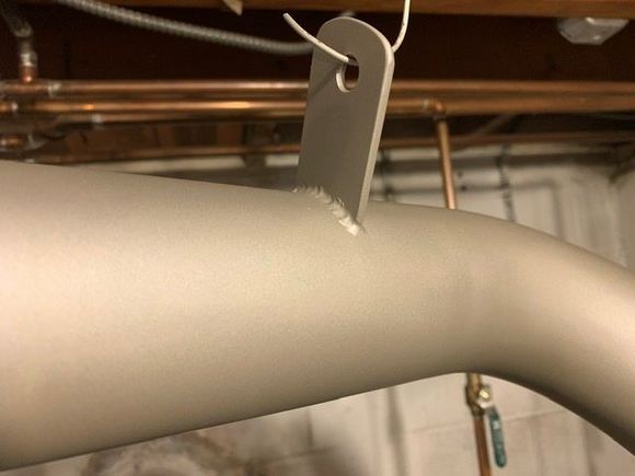 Muffler tail pipe coated with new hanger