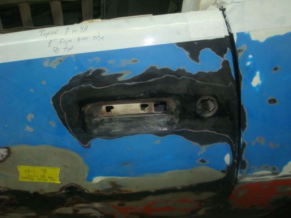 Driver side door handle, lock and mirror removed.