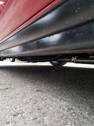 Looking back from the passenger side. 
U can see it doesnt even hang down lower than my sub-frame connectors. 