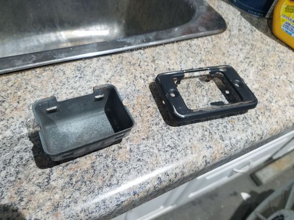 Hey, if I straightened these four little tabs, the cover plate can separate from the housing and the paint job will look even better!  I might need professional help...