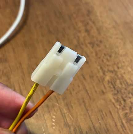 It’s as if they should plug in but they just won’t. The white plastic between the two prongs keeps it from plugging into the black one. 