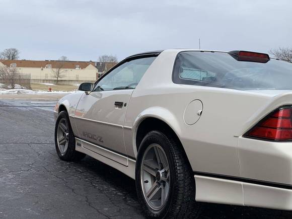 DO I see over spray on the tail light trim piece or is this from lighting?
