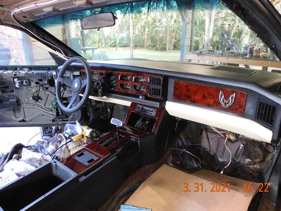 I am liking it without the wood grain on the gauges.  May just trim out the AC vents in the center and the headlight switch area on the left, and leave the 4 circular gauges with no wood.