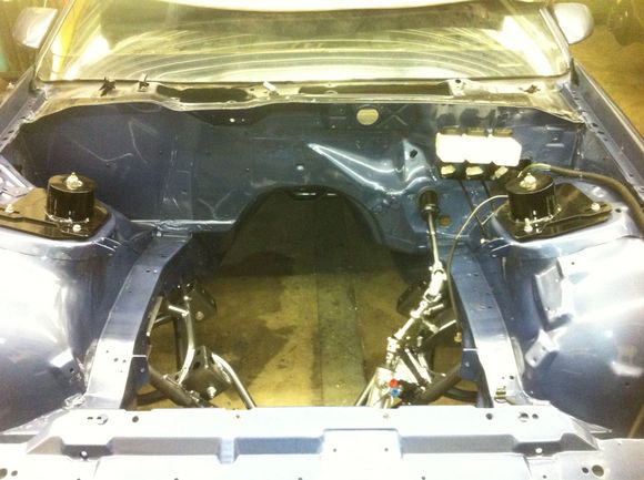 6. Clean looking engine bay. Those are mounts for a brace on the inside of the strut towers.