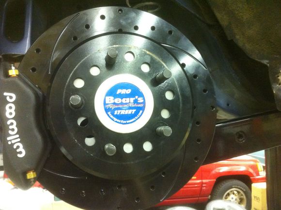 1. Wilwood 12.25" discs with 4 piston calipers and drum parking brake.
