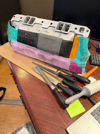 I ported the drivers side using the traditional carbide burrs and sandpaper abrasive rolls.  This method is effective but takes time to master, creates a huge mess, and poses the risk of gouging the aluminum from bad technique or a moments loss of concentration.

That’s when I came across an elegant solution considering the straight tunnel ram style. Use ordinary metal files! They are very precise, carry a low risk of damage, and so clean you can work on the intake on your desk at work!


